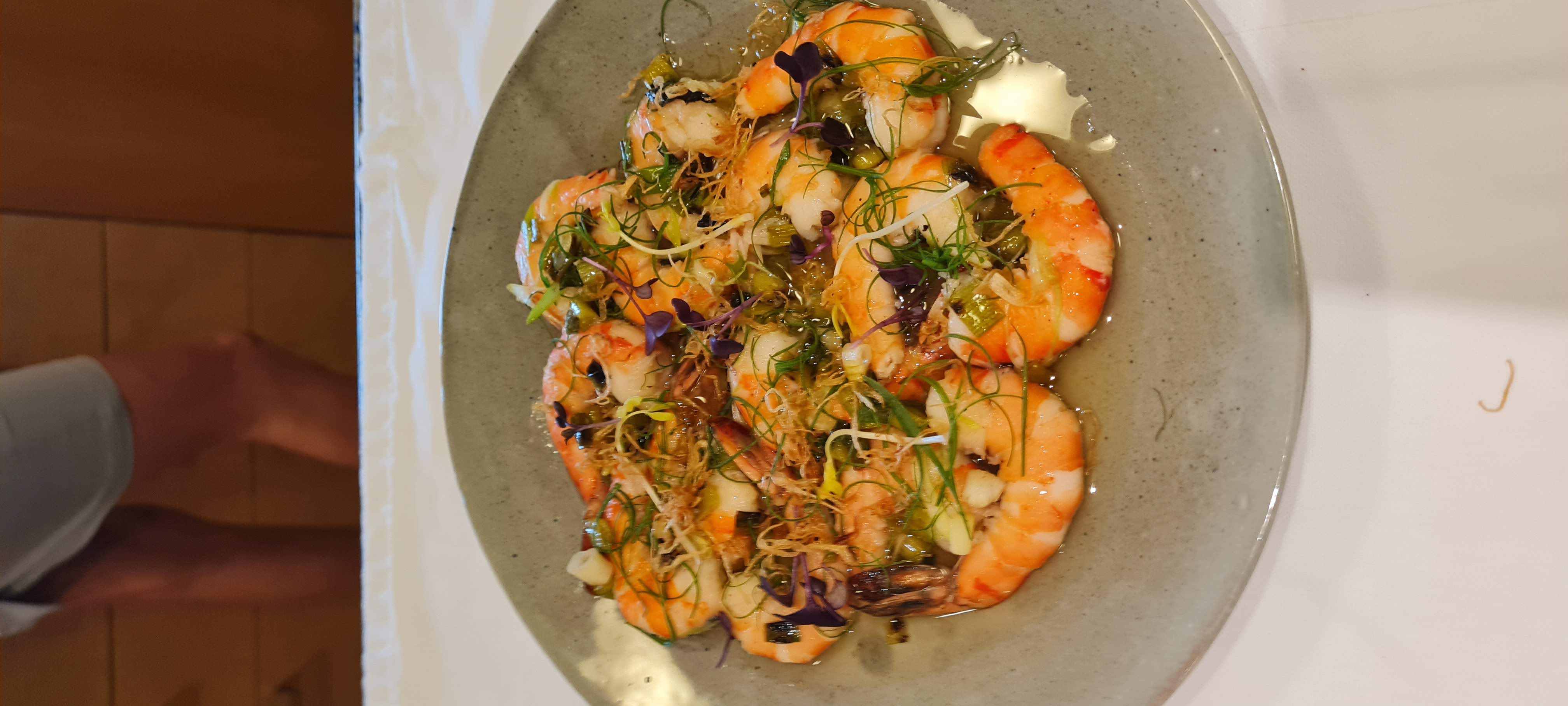 Refined shrimp dish with scallion and ginger accents
